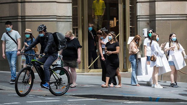 Shoppers wear masks on Castlereagh Street in Sydney.