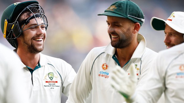 Travis Head and Nathan Lyon of Australia look on during day four 