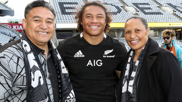 Caleb Clarke of the New Zealand All Blacks (C) meets with his father and former All Black Eroni Clarke (L) and mum Siala Clarke (R)