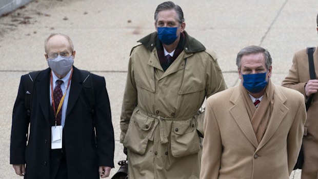 From left, David Schoen, Bruce Castor and Michael van der Veen, lawyers for former President Donald Trump, arrive at the Capitol on the third day of the second impeachment trial of Trump in the Senate, Thursday, Feb. 11, 2021, in Washington