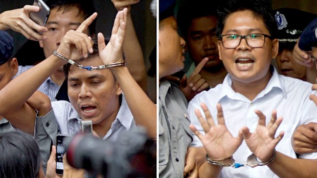 Reuters journalists Kyaw Soe Oo, left, and Wa Lone, are handcuffed as they are escorted by police out of a court in Yangon, Myanmar.
