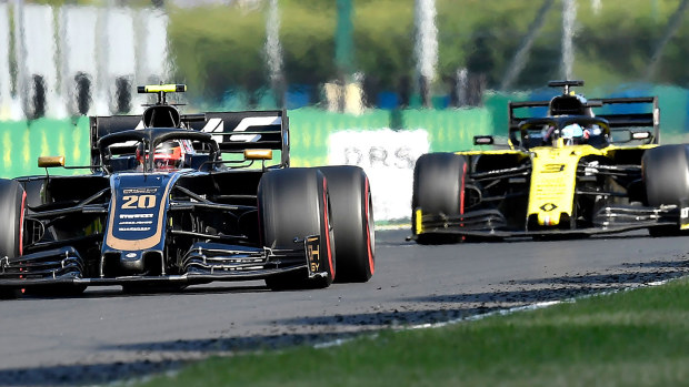 Kevin Magnussen (left) leads Daniel Ricciardo during the Hungarian Grand Prix.