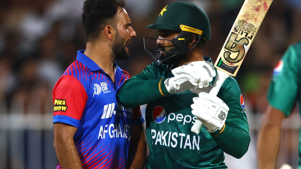 Fareed Ahmad Malik of Afghanistan exchanges words with Asif Ali of Pakistan during the Asian Cup match in Sharjah.