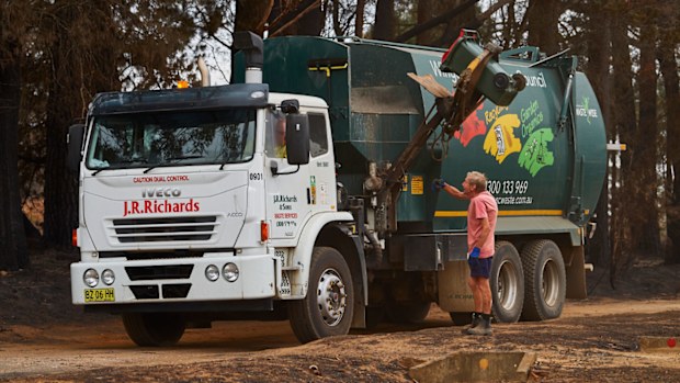 A man has been trapped in a garbage truck. (Stock image)
