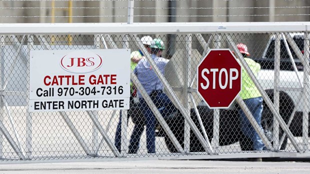 Employees in the carpark of the JBS Beef Production Facility in Greeley, Colorado.