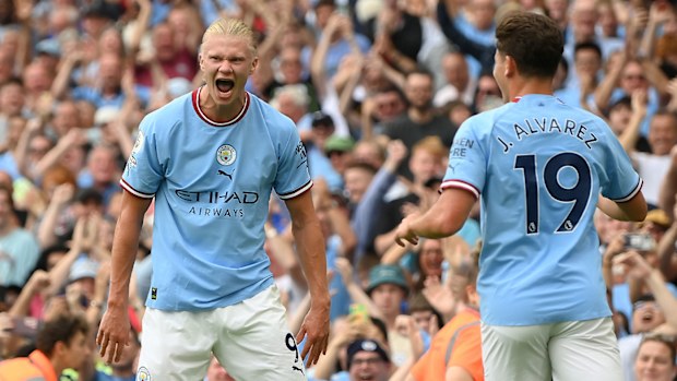 Erling Haaland celebrates a goal with Julian Alvarez