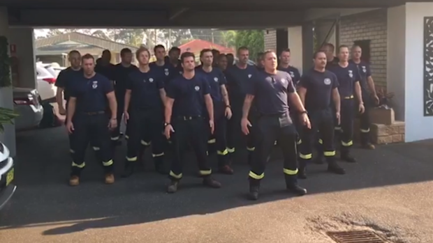 Firefighters from New Zealand perform the Haka before returning home