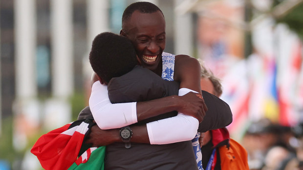 Kelvin Kiptum and his coach, Gervais Hakizimana, embrace after the Kenyan superstar broke the men's marathon world record in the 2023 Chicago Marathon.