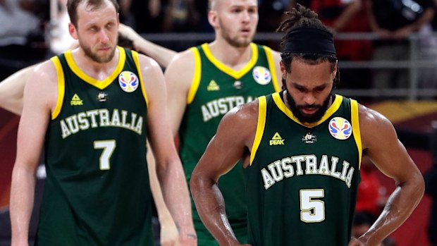 Joe Ingles, left, and Patty Mills of Australia react after their double overtime loss 
