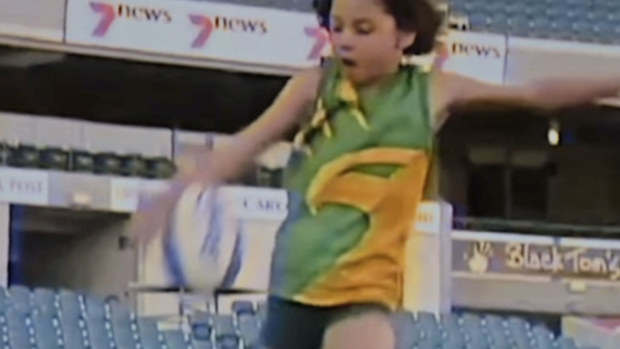 Young Sam Kerr playing Aussie Rules