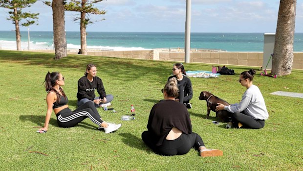 People are seen at Scarborough Beach in Perth.
