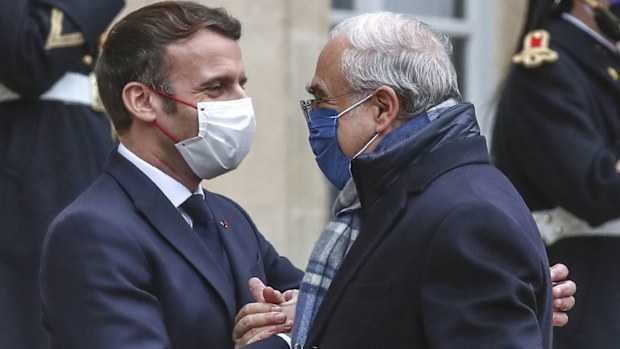 France's President Emmanuel Macron, left, welcomes OECD's Secretary General Angel Gurria for a working lunch at the Elysee Palace in Paris (Photo: December 14, 2020)