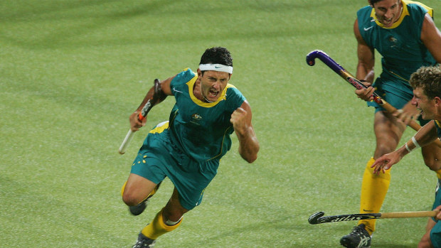 Jamie Dwyer and his Kookaburras teammates celebrate winning Olympic gold at Athens 2004.
