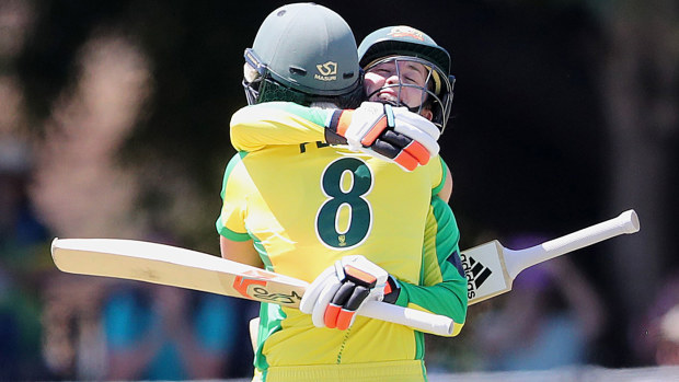 Rachael Haynes of Australia hugs team mate Ellyse Perry as she brings up 100 runs during game two of the International Women's One Day International Series between Australia and Sri Lanka 