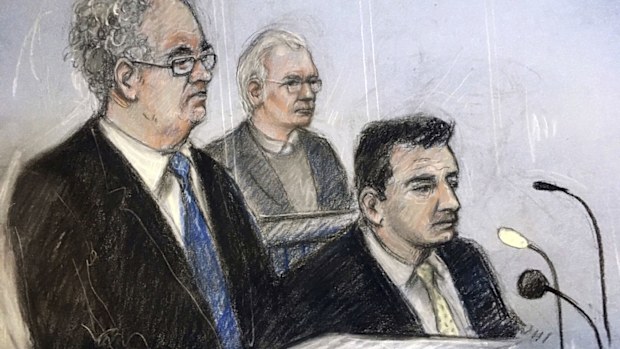 Court artist sketch by Elizabeth Cook of Julian Assange in the dock as his defence team, Edward Fitzgerald QC (left) and Mark Simmons QC, address Belmarsh Magistrates' Court in London for the Wikileaks founder's extradition hearing.