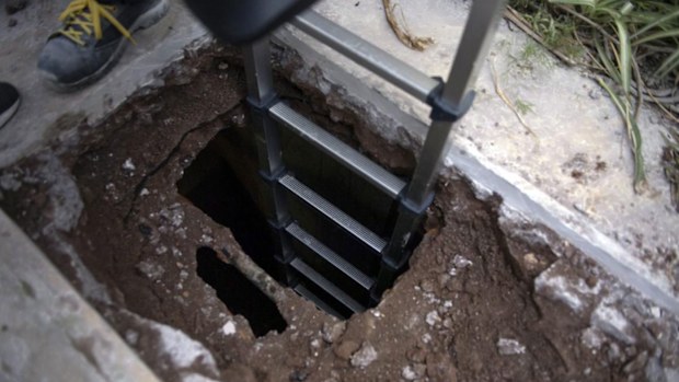 A handout picture provided by the Vatican Media shows the opening of two tombs at the Teutonic Cemetery.