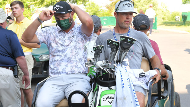 Jon Rahm of Spain gets shuttled away after testing positive for COVID-19