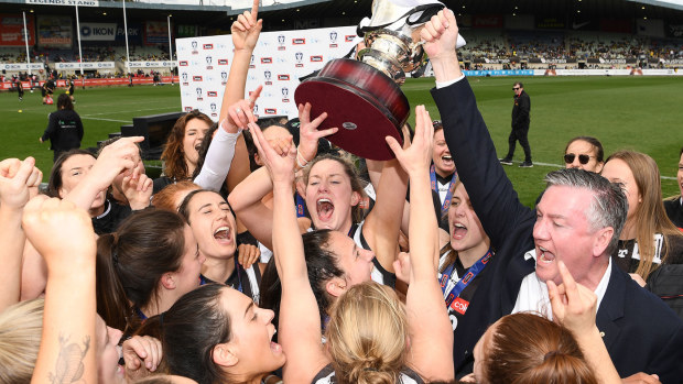 Collingwood President Eddie McGuire celebrates with the Magpies players after winning the VFLW Grand Final match against the Western Bulldogs