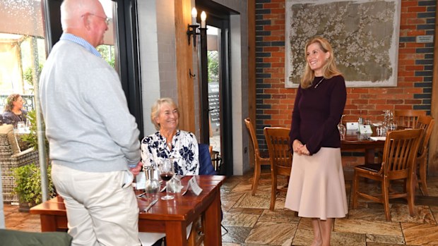 Sophie, Countess Of Wessex speaks to guests during her visit at 'The Half Moon' public house on July 08, 2020 in Windlesham, England