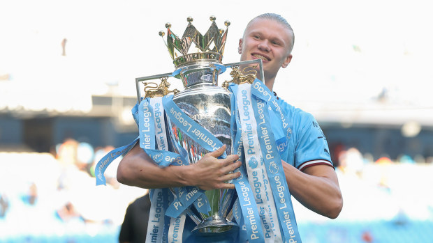 Erling Haaland of Manchester City celebrates with the Premier League trophy following the Premier League match between Manchester City and Chelsea FC at Etihad Stadium on May 21, 2023 in Manchester, England. (Photo by Catherine Ivill/Getty Images)