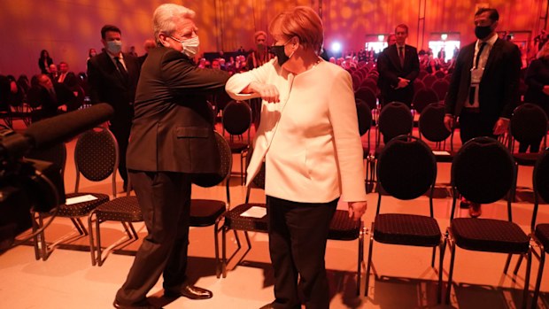 German Chancellor Angela Merkel (R) and former German President Joachim Gauck arrive for the official commemoration event on the 30th anniversary of German reunification on October 03, 2020 in Potsdam, Germany