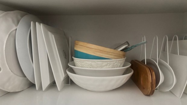 Kmart file racks used to organise platters in kitchen cupboards, storage hack