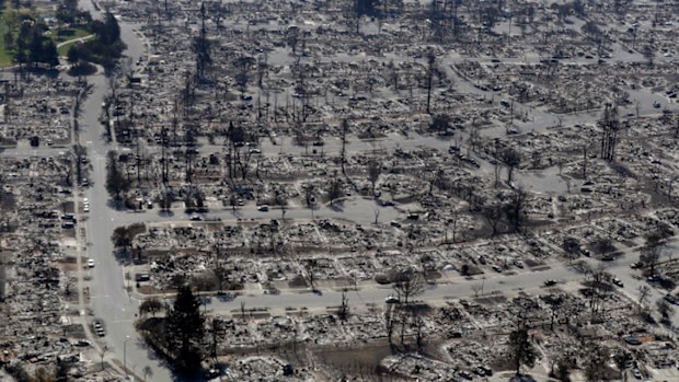 An aerial view shows the devastation of the Coffey Park neighborhood after a wildfire swept through Saturday, Oct. 14, 2017, in Santa Rosa, Calif. (AP Photo/Marcio Jose Sanchez)