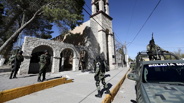 National Guard soldiers take position before the arrival of Coahuila Governor Miguel Riquelme.