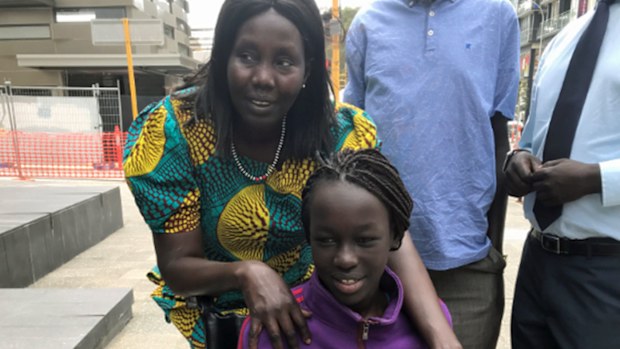 Sunday Mabior with her mother Mary Kelei outside the WA District Court in Perth on Friday. (AAP)