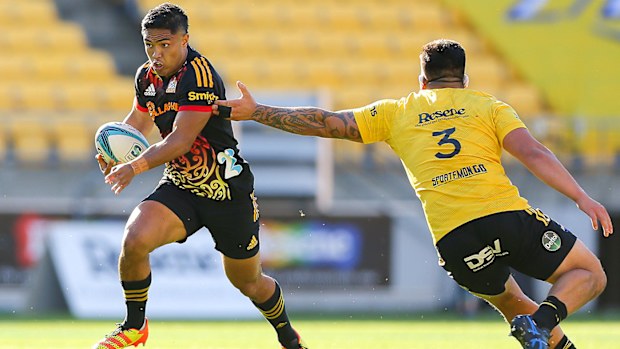 Josh Ioane of the Chiefs makes a break during the round seven Super Rugby Pacific match between the Hurricanes and the Chiefs at