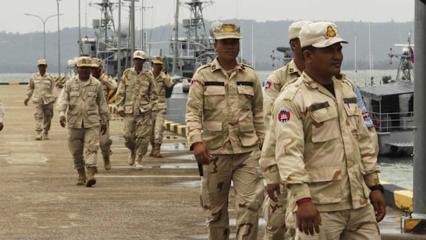 Cambodian navy troop members walk at Ream Naval Base in Sihanoukville, southwestern of Phnom Penh.