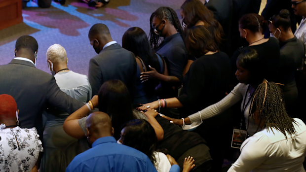 Guests pause for 8 minutes, 46 seconds of silence during a memorial service for George Floyd at North Central University Thursday, June 4, 2020, in Minneapolis. (AP Photo/Julio Cortez)