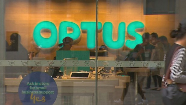 Customers inside an Optus store.