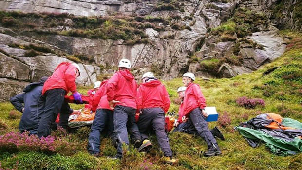 An Irish man has been rescued after being hit by a falling sheep while hiking near Hares Gap, Northern Ireland.