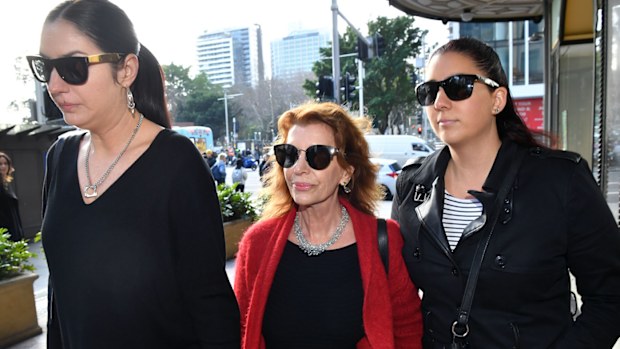 Rosa Miano (centre), wife of John Jarratt, arrives at the Downing Centre Local Court in Sydney.