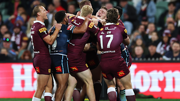 Lindsay Collins and Liam Martin tussle during game one of the 2023 State of Origin.