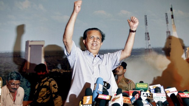 Indian Space Research Organization Chairman G. Madhavan Nair raises his hands to celebrate the successful launch of India's maiden lunar mission Chandrayaan-1.