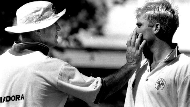 Greg Matthews helps Shane Warne with some sunscreen in the summer of 1992-93.