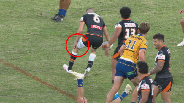 Tigers star Adam Doueihi was forced off the ground with a left knee injury in the second half