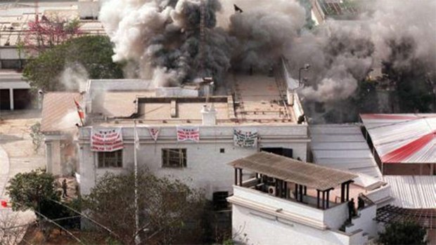 Plumes of smoke pour out of the building during the raid.