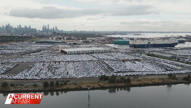 Several car-carrying ships that remain offshore, awaiting clearance to berth.