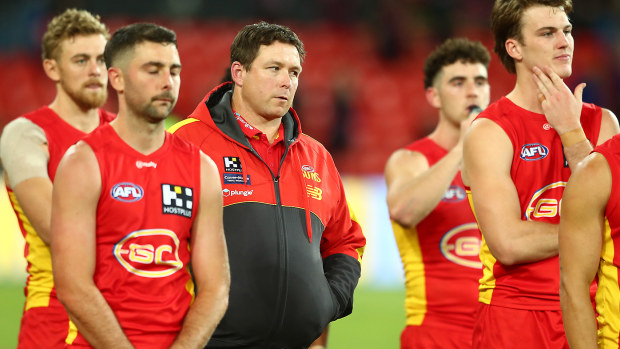 Suns coach Stuart Dew and players look on 