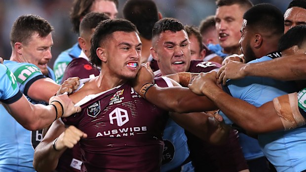 Tino Fa'asuamaleaui of the Maroons and Payne Haas of the Blues scuffle during game two of the 2020 State of Origin series