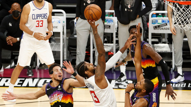 Paul George #13 of the LA Clippers goes up for a shot against the Phoenix Suns during the second half in Game Five of the Western Conference Finals