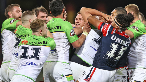 Players scuffle during the round 10 NRL match between the Sydney Roosters and the Canberra Raiders