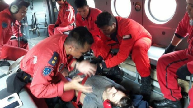 Mr Gaskell with rescuers. (Miri Fire and Rescue Department (Bomba))