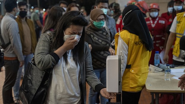 Relatives of Sriwijaya Air flight SJ 182 arrive at the crisis centre in Soekarno Hatta Airport, on January 09, 2021 in Jakarta, Indonesia