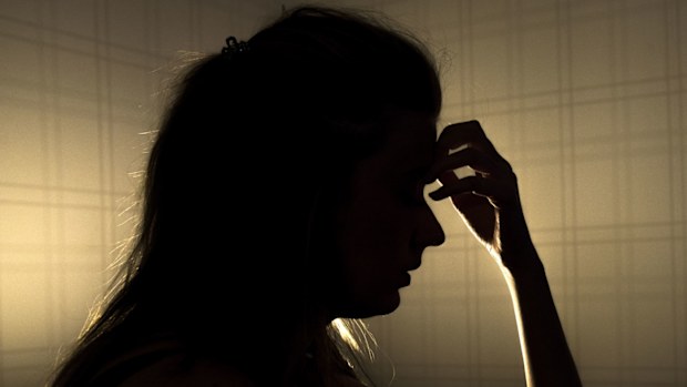 Woman with migraine