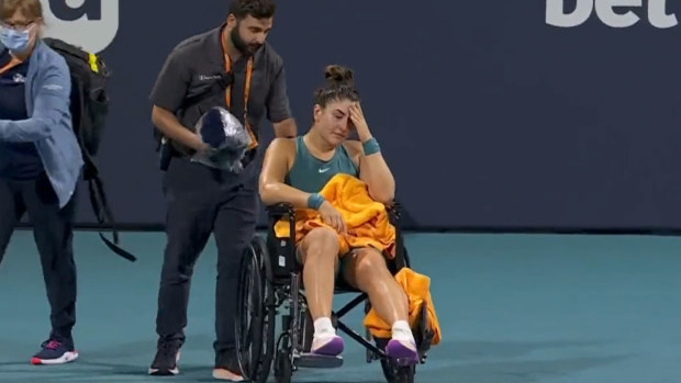 A heartbroken Andreescu was carted off the court in Miami after turning her ankle in the fourth round clash