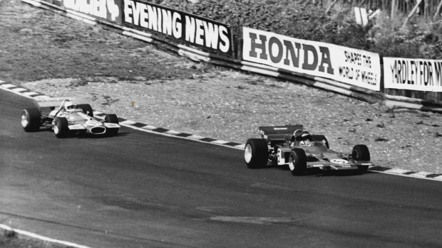Jochen Rindt leads Jack Brabham at the 1970 British Grand Prix.